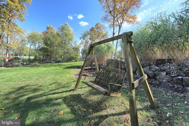 view of play area featuring a lawn