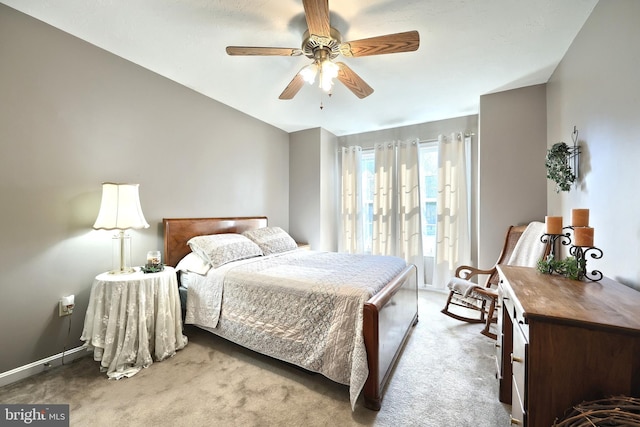 bedroom with ceiling fan and light colored carpet