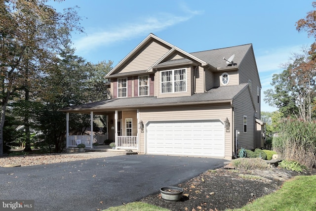 view of front of home with a garage and covered porch