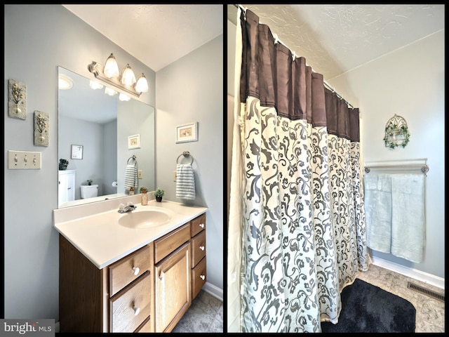 bathroom featuring walk in shower, vanity, and toilet