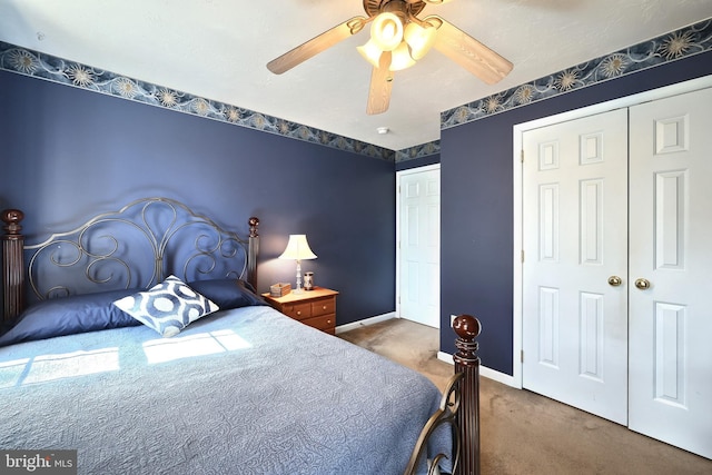 carpeted bedroom featuring ceiling fan and a closet