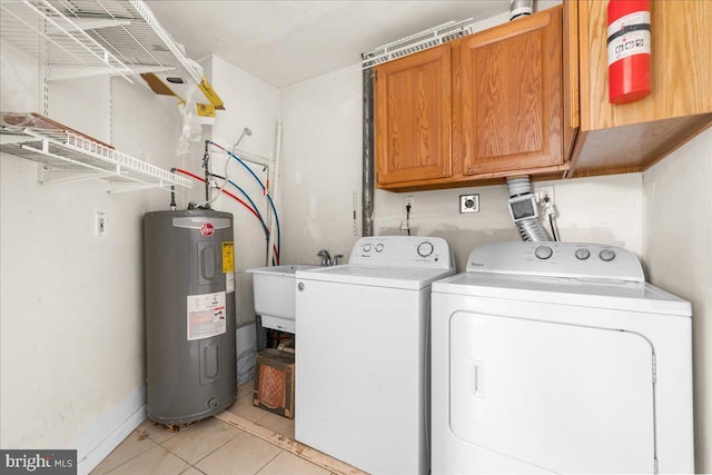 laundry room featuring light tile patterned floors, separate washer and dryer, a sink, electric water heater, and cabinet space