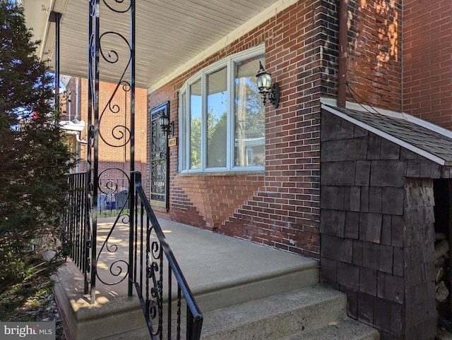 view of property exterior featuring covered porch