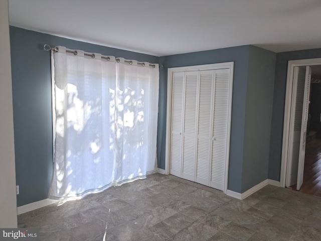 unfurnished bedroom with a closet