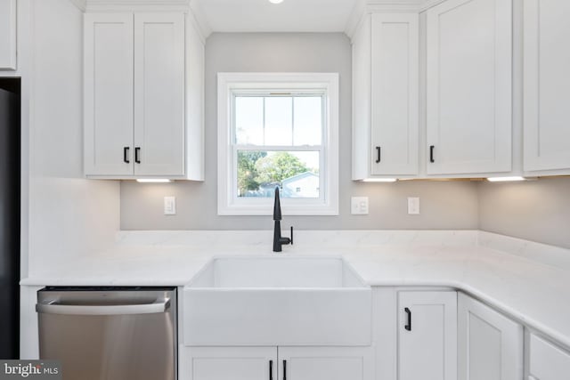 kitchen featuring sink, light stone countertops, white cabinetry, and stainless steel dishwasher