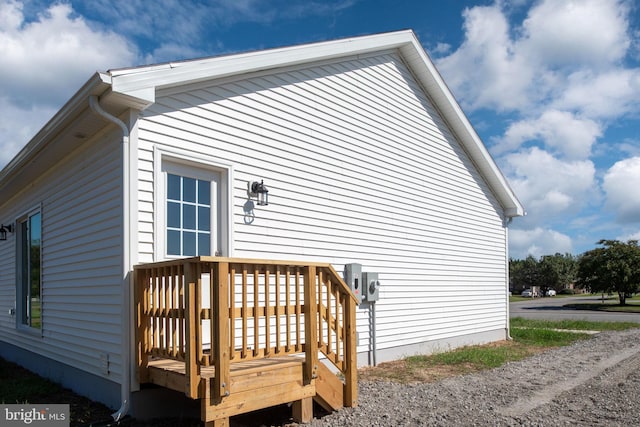 view of home's exterior featuring a deck