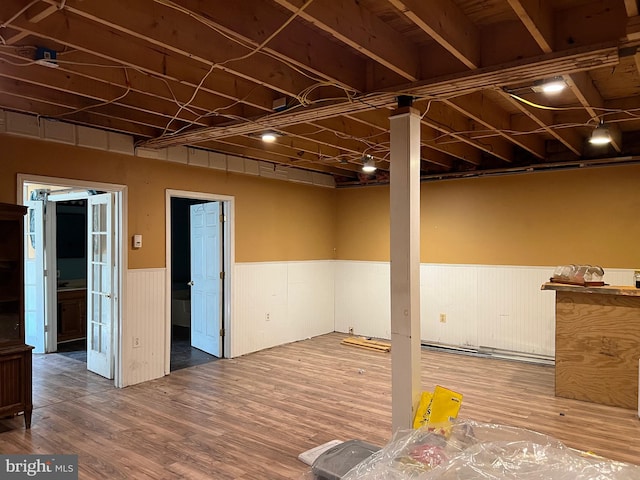 basement featuring wood-type flooring