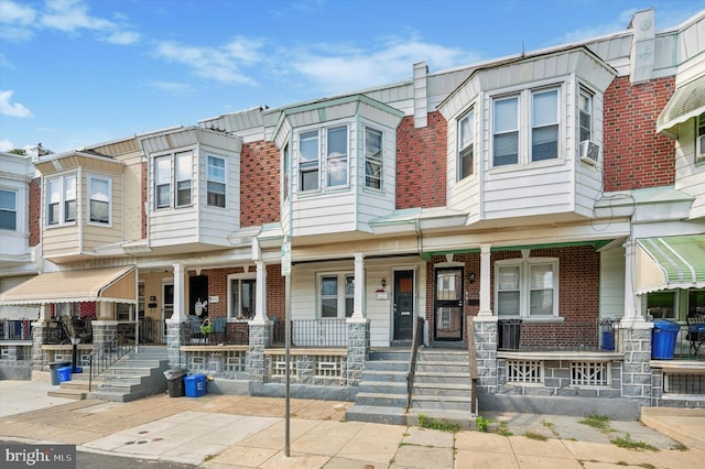 townhome / multi-family property with covered porch