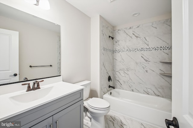 bathroom with toilet, vanity, marble finish floor, and tub / shower combination