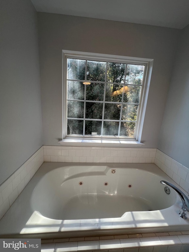 bathroom with tiled tub