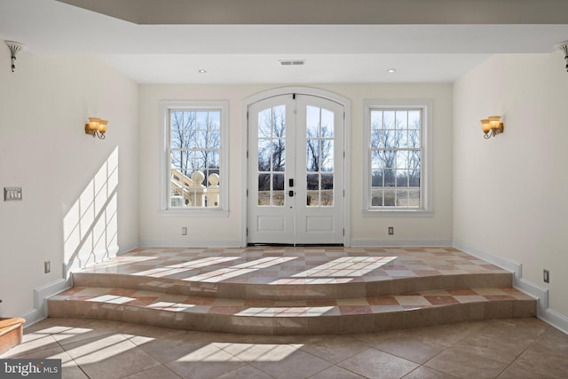 foyer entrance with recessed lighting, baseboards, visible vents, and french doors