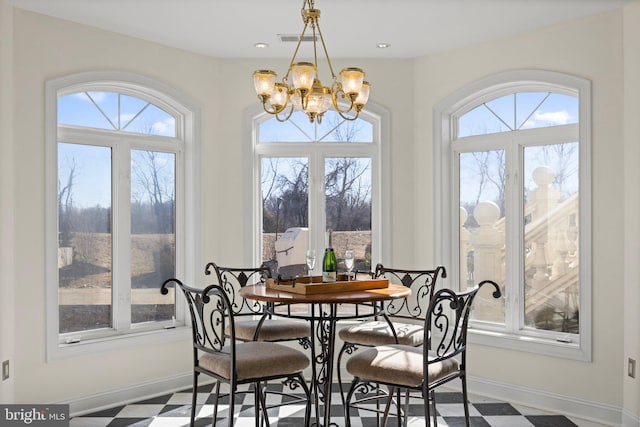 dining area featuring plenty of natural light, baseboards, and tile patterned floors