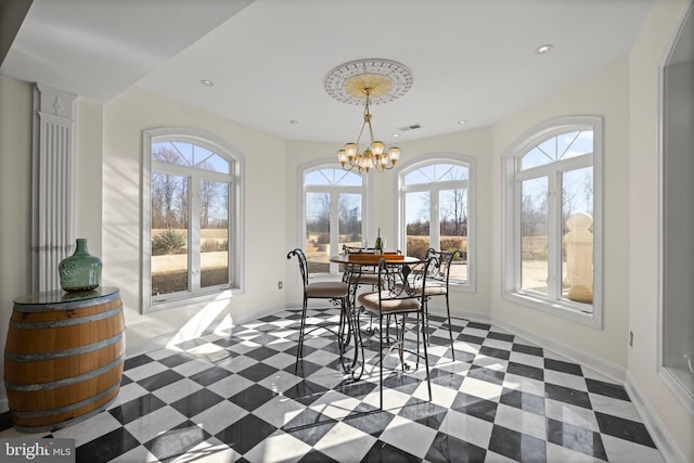 dining area featuring baseboards, visible vents, a chandelier, and recessed lighting