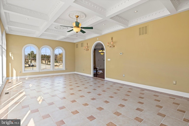 spare room with arched walkways, coffered ceiling, visible vents, baseboards, and a ceiling fan