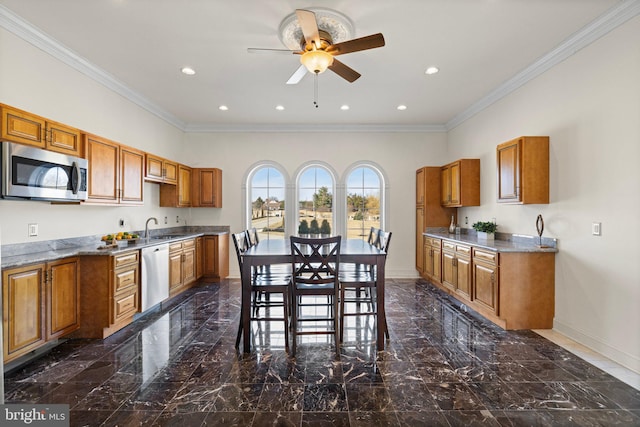 kitchen featuring dishwashing machine, stainless steel microwave, and brown cabinetry