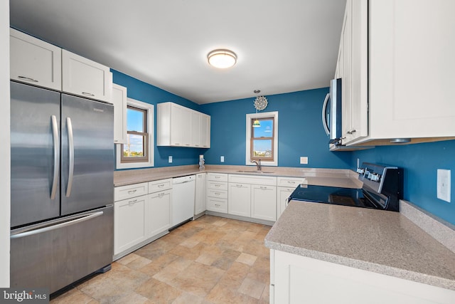 15 Weldon Pl, Long Beach Township, NJ 08008 - kitchen with a sink, white cabinetry, stainless steel appliances, and stone finish flooring