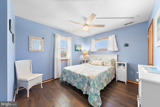 bedroom with ceiling fan and dark hardwood / wood-style floors