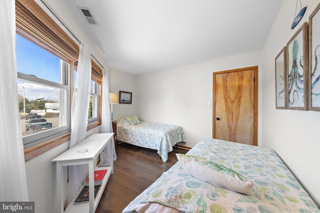 bedroom featuring dark hardwood / wood-style flooring