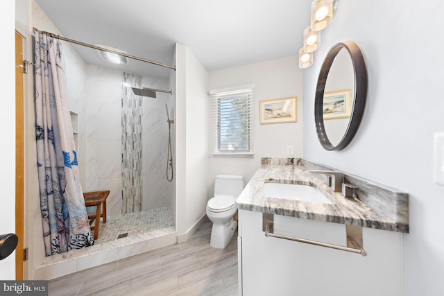 15 Weldon Pl, Long Beach Township, NJ 08008 - bathroom with baseboards, toilet, wood finished floors, vanity, and tiled shower