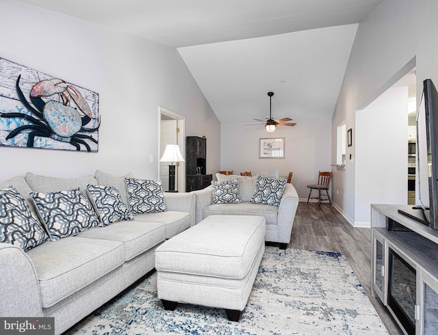 living room with lofted ceiling, wood-type flooring, and ceiling fan