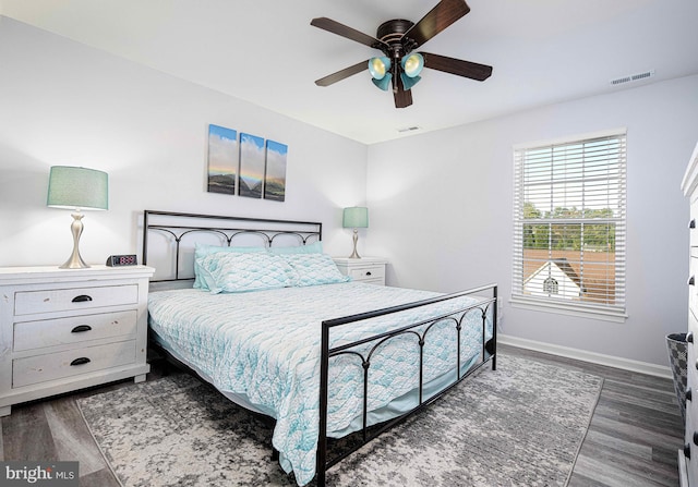 bedroom featuring dark wood-type flooring and ceiling fan