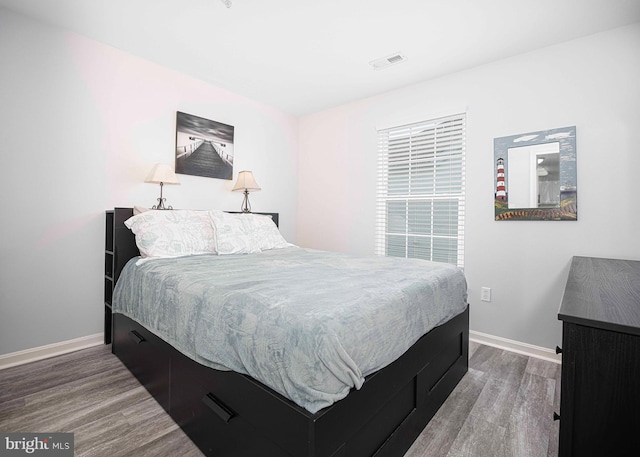 bedroom with hardwood / wood-style flooring