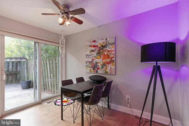 dining room featuring ceiling fan and hardwood / wood-style floors