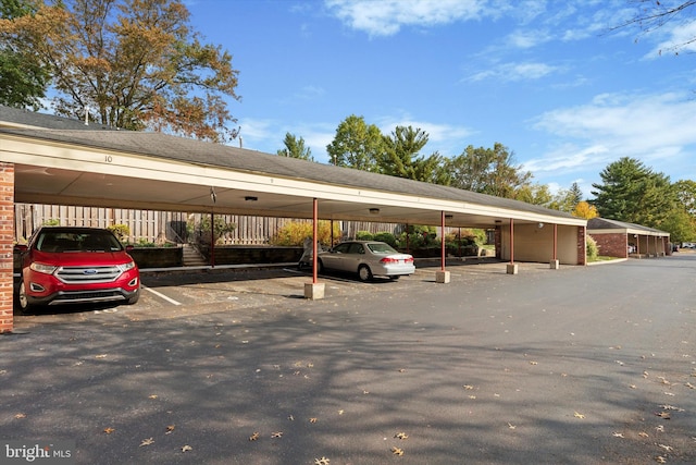 view of parking / parking lot with a carport