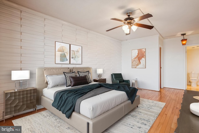 bedroom featuring ceiling fan and wood finished floors