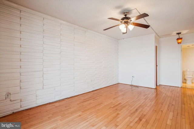 unfurnished room with light wood-style flooring and a ceiling fan