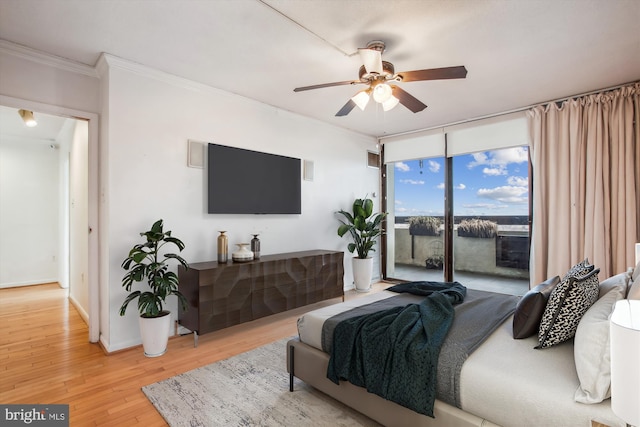 bedroom with ceiling fan, light wood-style flooring, baseboards, access to outside, and ornamental molding