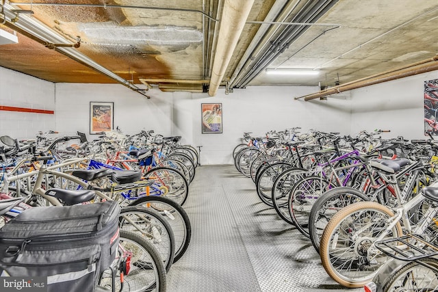 garage with concrete block wall and bike storage