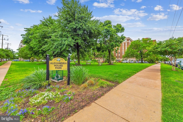 view of property's community with a yard