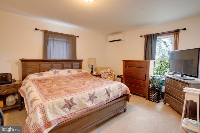 bedroom featuring light carpet and a wall unit AC