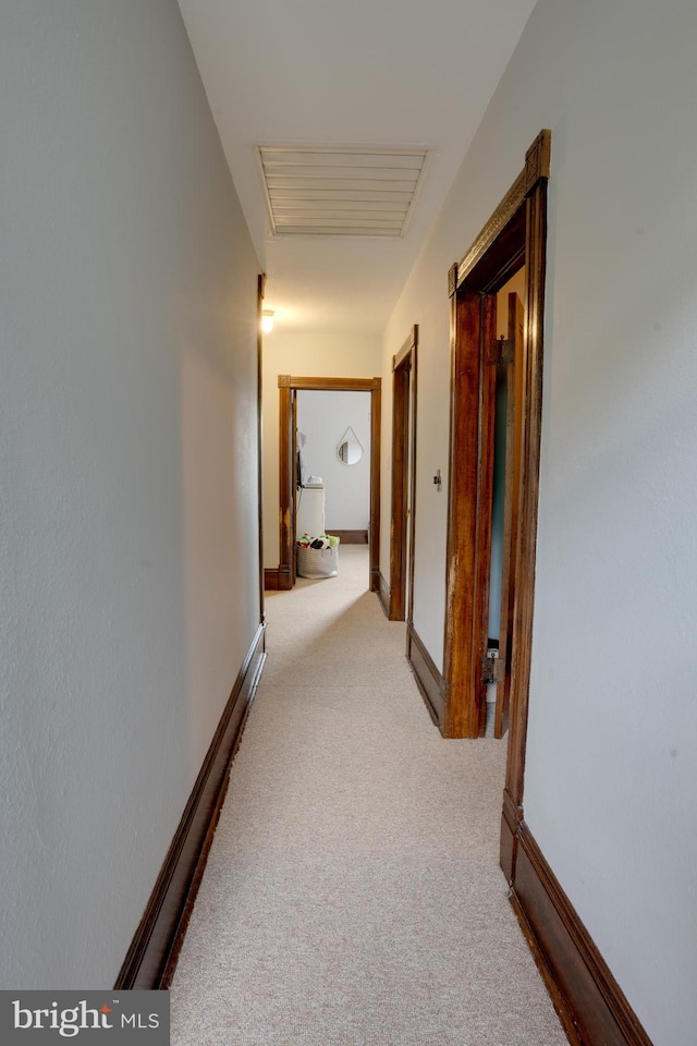 corridor with light carpet