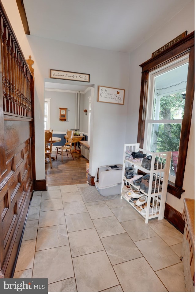 hallway featuring light tile patterned floors