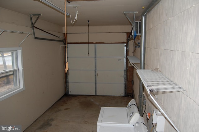 garage featuring washing machine and dryer