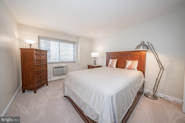 bedroom featuring a wall mounted air conditioner, light colored carpet, and baseboard heating