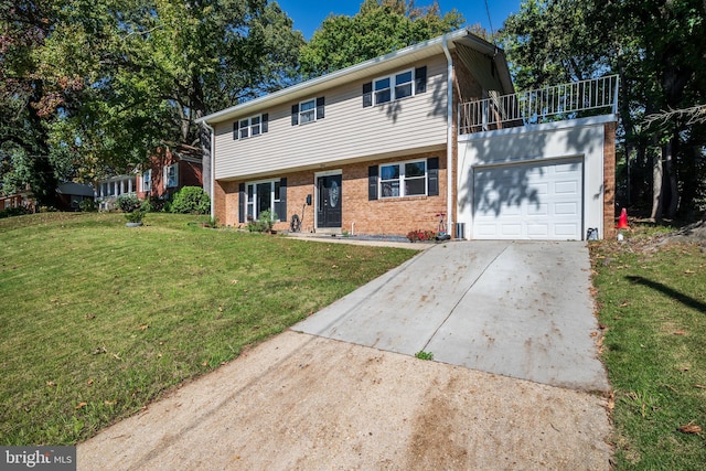 view of front of home featuring a garage and a front yard