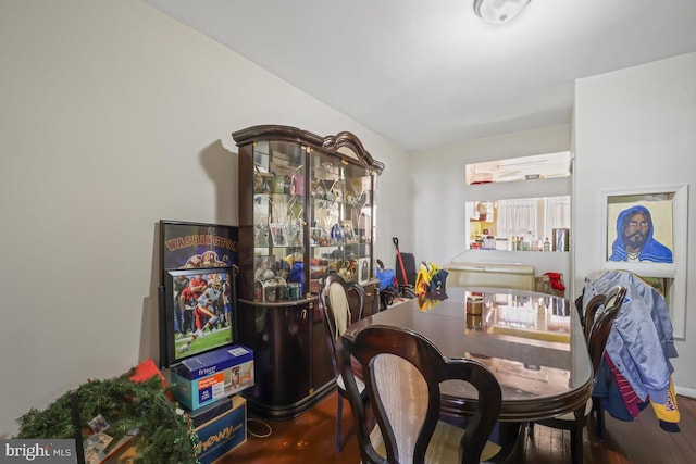 dining space with hardwood / wood-style floors