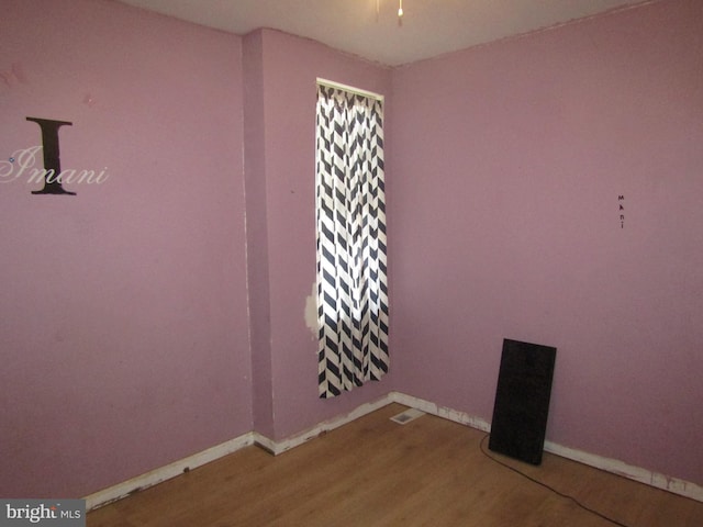 spare room with hardwood / wood-style floors