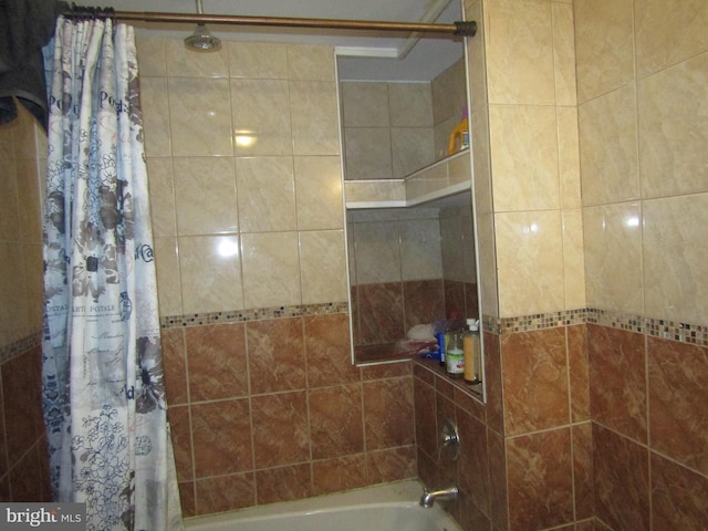 bathroom with shower / bath combination with curtain