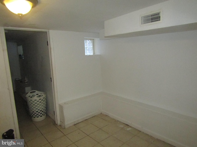 basement with light tile patterned floors