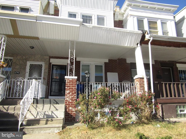 doorway to property with a porch