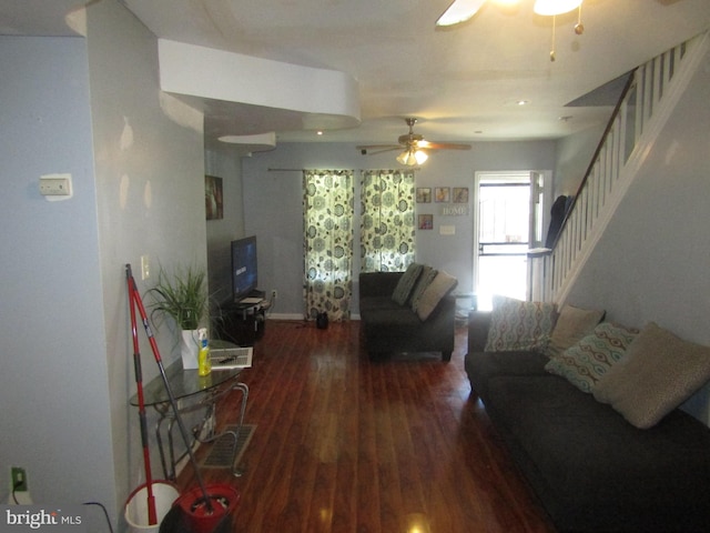 living room featuring dark hardwood / wood-style floors and ceiling fan