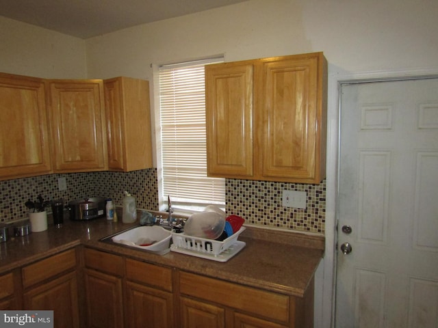 kitchen with sink and tasteful backsplash