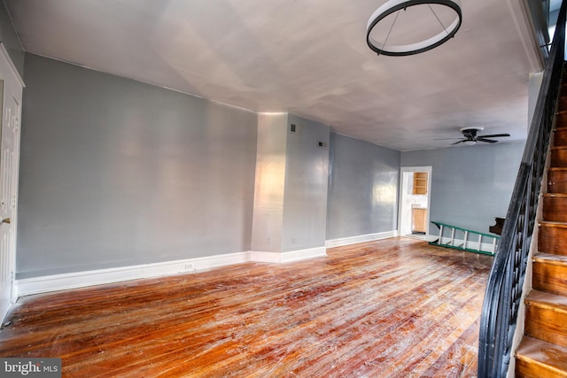 interior space featuring wood-type flooring and ceiling fan