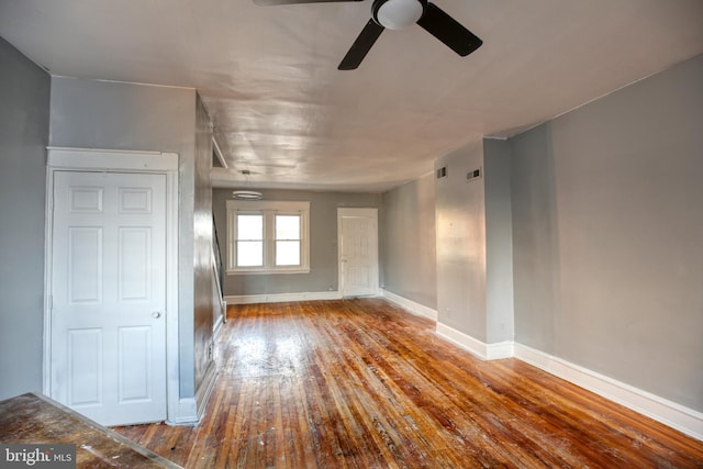 interior space with wood-type flooring and ceiling fan