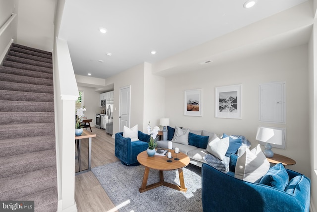 living room with light hardwood / wood-style flooring