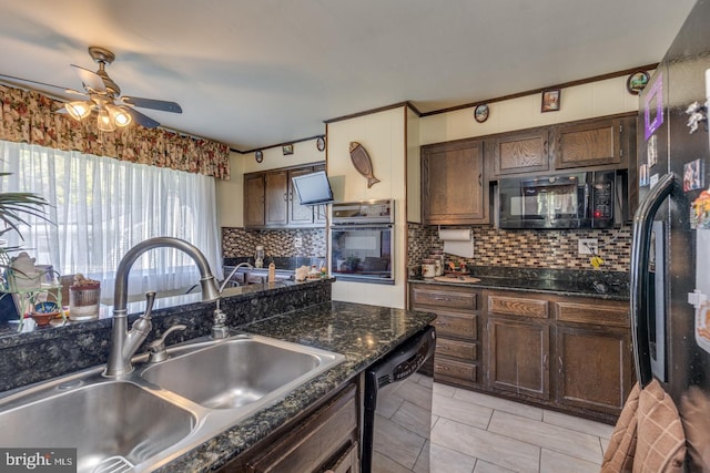 kitchen featuring backsplash, black appliances, sink, ceiling fan, and dark brown cabinetry